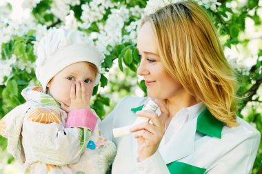 Baby and doctor with inhaler clipart