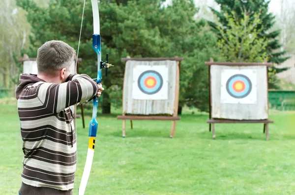 Archer aiming with bow — Stock Photo, Image