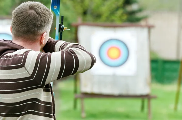 Archer aiming with bow — Stock Photo, Image