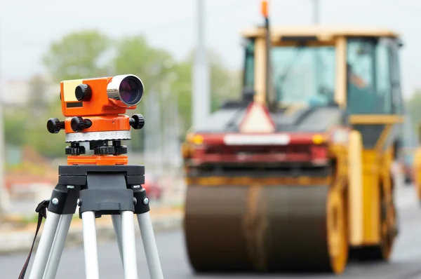 Survey equipment at asphalting works — Stock Photo, Image
