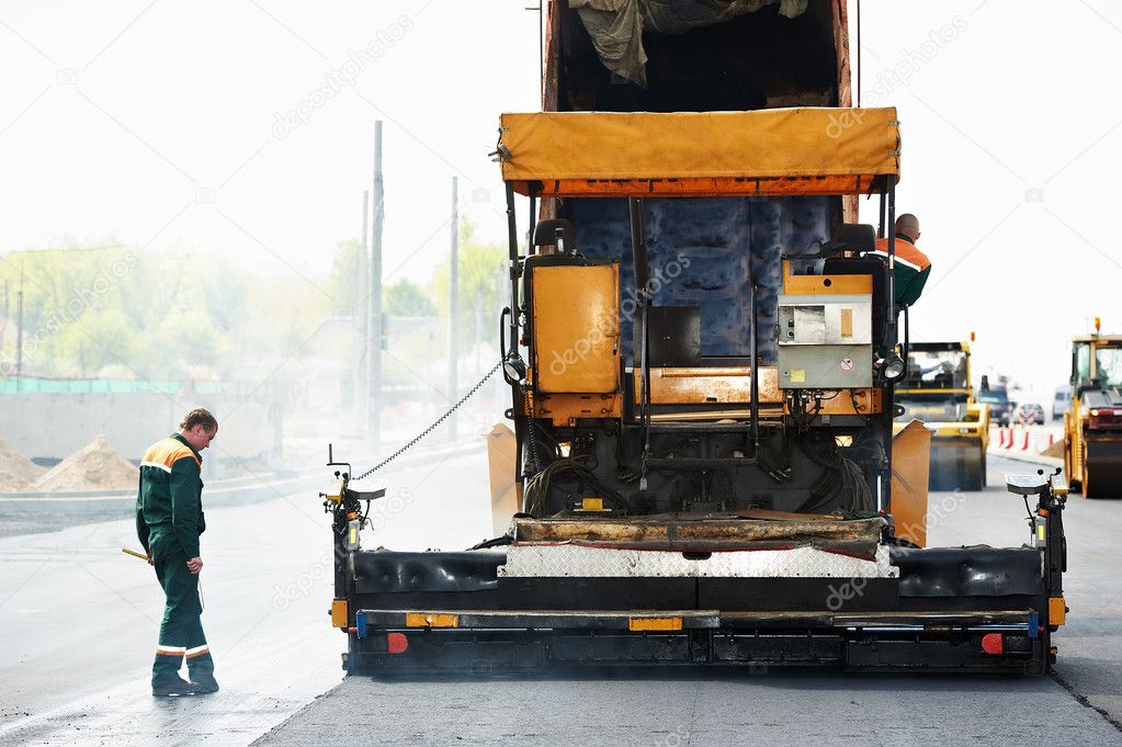 Worker at asphalting works