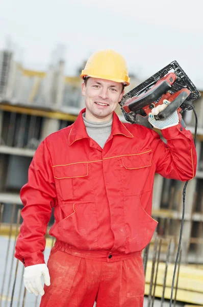 Portrait of construction worker with saw — Stock Photo, Image