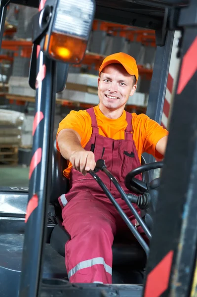 Warehouse worker driver in forklift — Stock Photo, Image