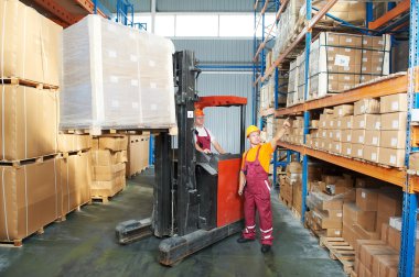 Distribution in warehouse with forklift clipart