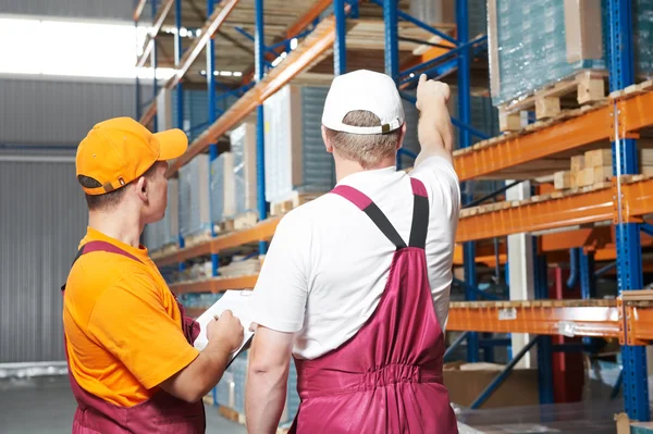 Manual workers in warehouse — Stock Photo, Image