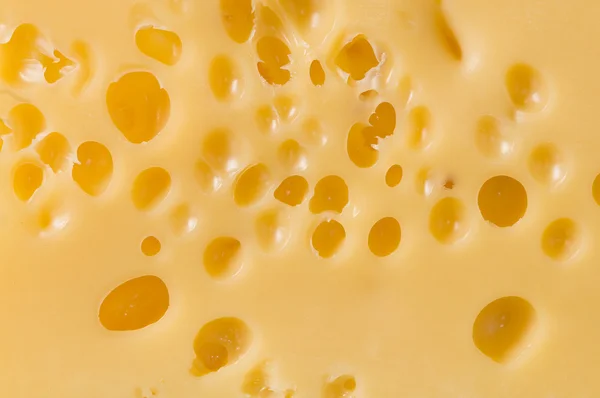 Yellow cheese background — Stock Photo, Image