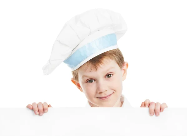 Мальчик-повар с чистым билбордом — стоковое фото
