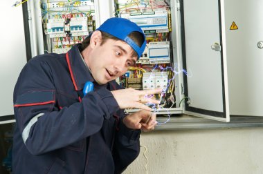 Worker under electric shock clipart