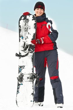 snowboard ile mutlu bir kadın