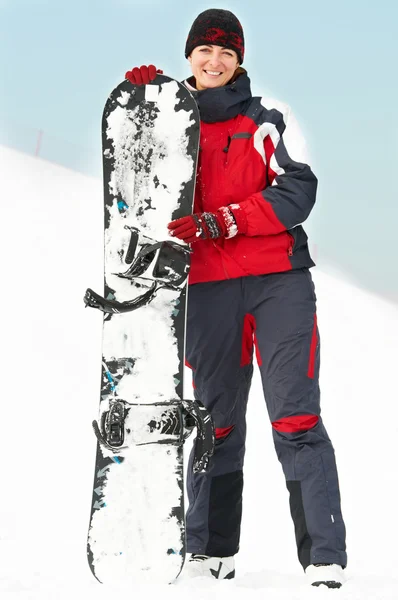 Femme heureuse avec snowboard — Photo