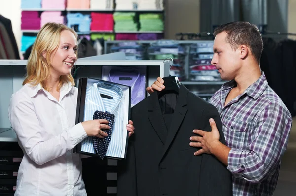 Young couple at clothes shopping — Stock Photo, Image