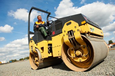 Compactor roller at road work clipart