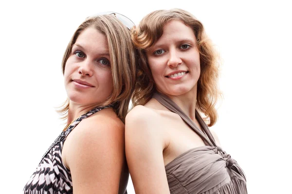 Δύο σέξι γυναίκες συνεργαζόμενα πλάτη με πλάτη. — Φωτογραφία Αρχείου