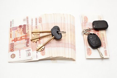 Car key and stack of money cashnotes clipart