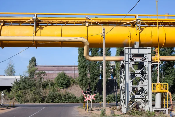 Industrial gas and oil pipelines on metal in a metallurgical plant — Stok fotoğraf
