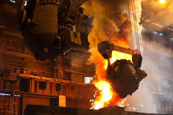 Smelting metal in a metallurgical plant.