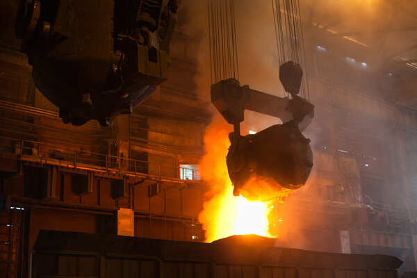 Smelting metal in a metallurgical plant.