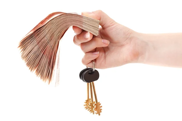 Car key in hand and cash money in other hand — Stock Photo, Image