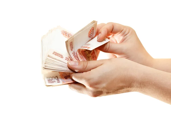 Pacote de dinheiro nas mãos de mulheres isoladas em um fundo branco — Fotografia de Stock