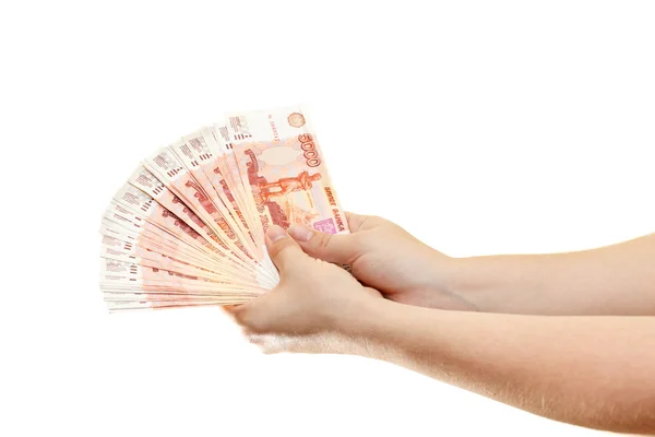 Paquete de dinero en manos de mujeres aisladas sobre un fondo blanco — Foto de Stock