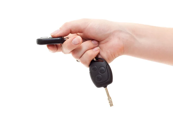 Hand with alarm keys pushing the button — Stock Photo, Image