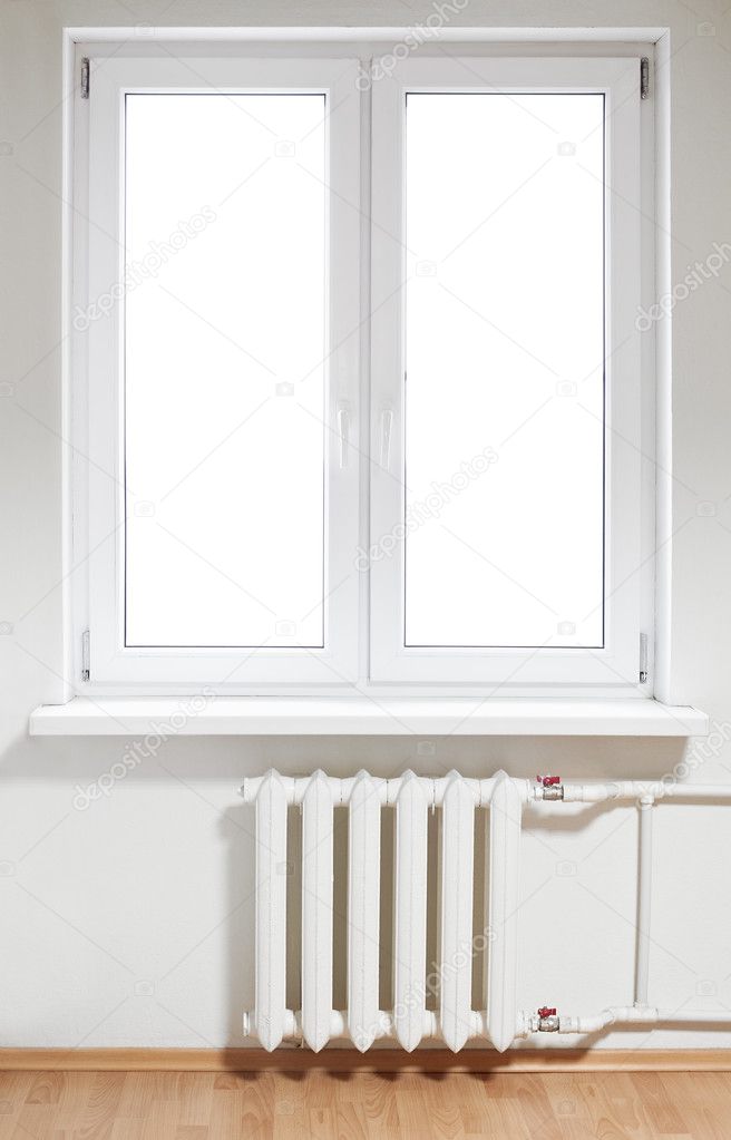 White plastic double door window with radiator under it