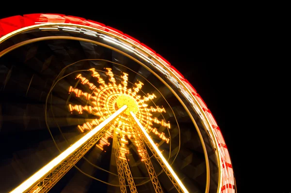 stock image Spinning merry-go-round at night park