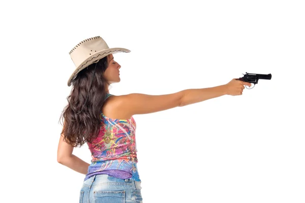 Stock image Young dark haired woman wear a hat aim a gun