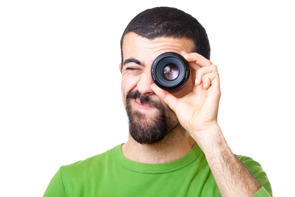 Genç adam lens aracılığıyla arıyor — Stok fotoğraf