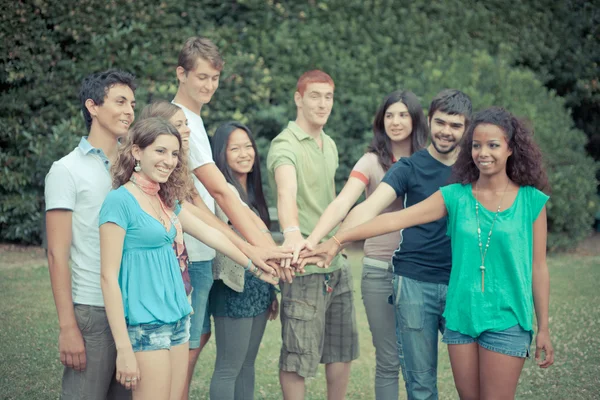 Happy Teenage Group with Hands on Stack — Stock Photo, Image