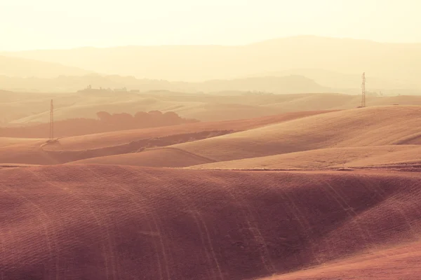 Toskanische Hügel bei Sonnenaufgang — Stockfoto