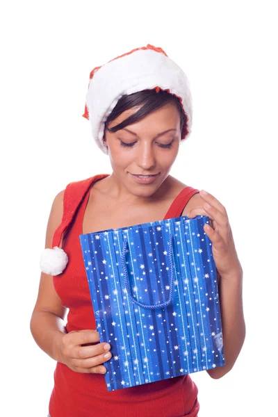 Seksi kadın ile santa şapka ve Noel hediyeleri — Stok fotoğraf