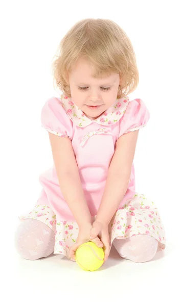 Little girl and tennis ball. — Stock Photo, Image
