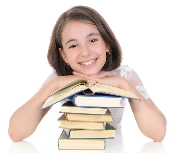 De schoolmeisje met boeken. — Stockfoto