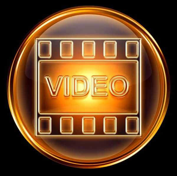 Icono de vídeo dorado, aislado sobre fondo negro —  Fotos de Stock