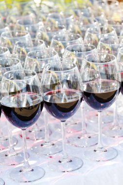 Glass drink red wine on buffet outdoor party clipart