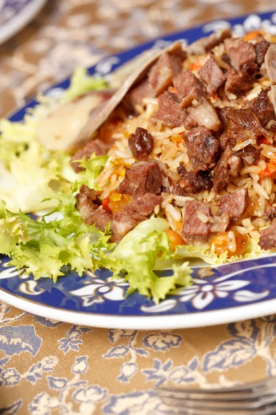 Uzbek national dish - plov with horse meat — Stock Photo, Image