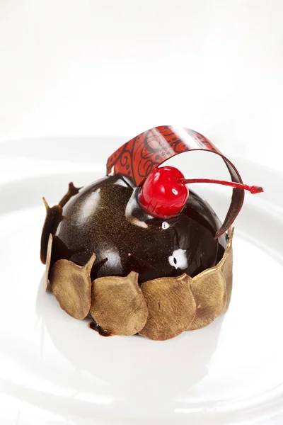 Chocolate pastry with cherry — Stock Photo, Image