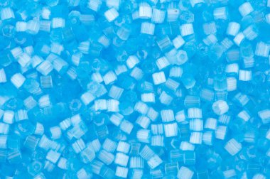 Background of blue decorative plastic craft beads clipart