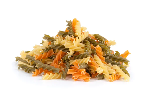 Uncooked pasta fusilli in different colours — Stock Photo, Image