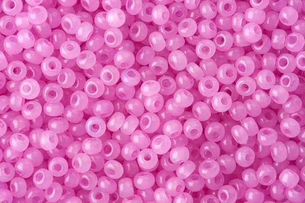 Rosa polierte Perlen Hintergrund — Stockfoto