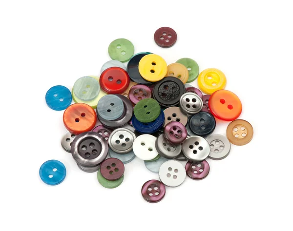 Montão de vários botões no fundo branco — Fotografia de Stock