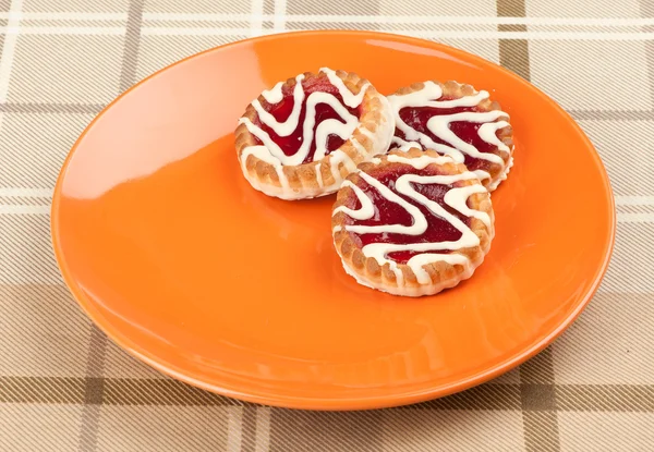 Three cookies on a plate — Stockfoto