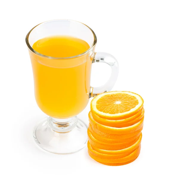Glass of juice and orange slices — Stock Photo, Image