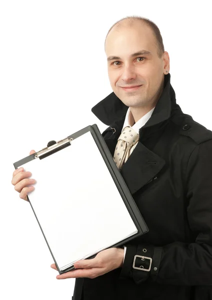 Hombre de negocios sonriente sostiene una hoja de papel en blanco — Foto de Stock