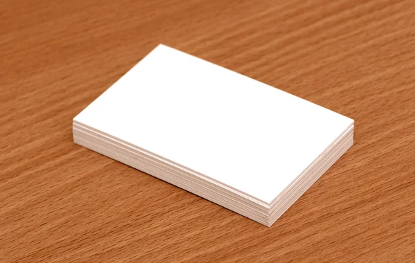 Blank business cards stacked up on a desk — Stock Photo, Image