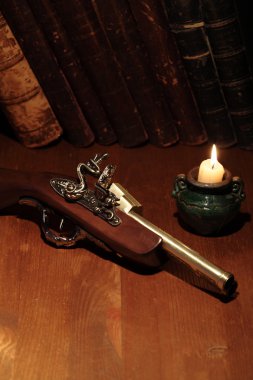 Old Pistol And Books