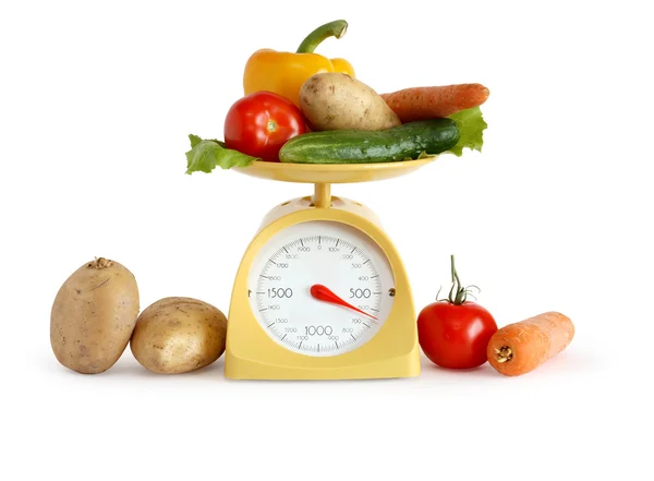 Овощи по шкале веса — стоковое фото