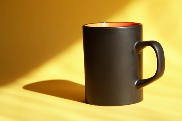 Black Mug On Yellow — Stock Photo, Image