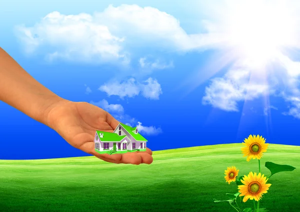 Small house on a hand — Stock Photo, Image